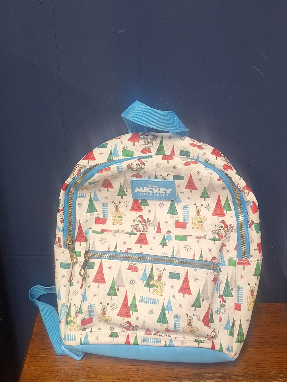 Disney Cream Backpack with Blue Trim and Multi-Color Print